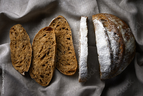 Photography Appetizing rye sourdough bread slices on a rustic linen towel