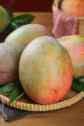 Fresh Ripe Kates Mangoes from Panzhihua Orchard in Traditional Bamboo Basket