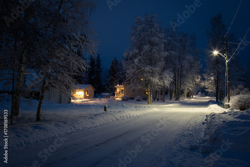 Evening street with electric lighting in a winter Swedish village