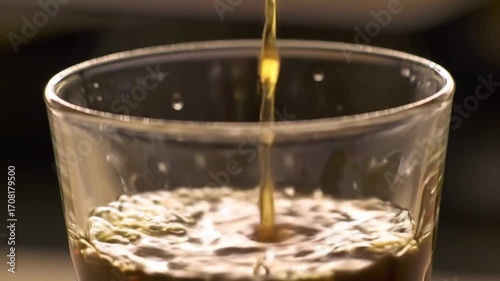 Slow Motion Coffee Pouring into Transparent Glass with Aesthetic Lighting