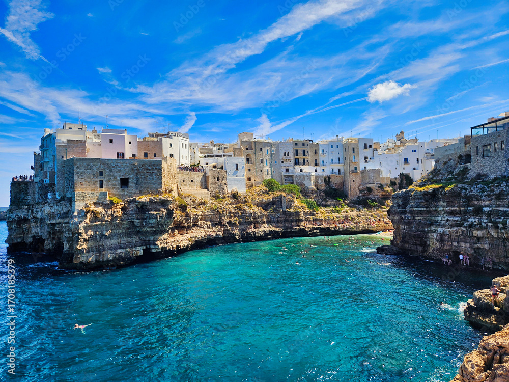 Fototapeta premium . Piombino view from piazza bovio. Cliffs on adriatic sea. Coastal town nestled in cliffs. Antalya old harbour view. Trani cathedral. Shoreline of some greek island.