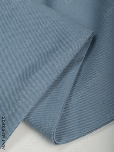 Light blue dense fabric, ironed, the texture of the fabric is visible