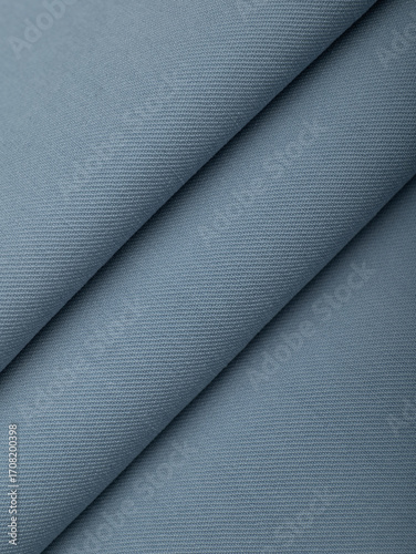 Light blue dense fabric, ironed, the texture of the fabric is visible
