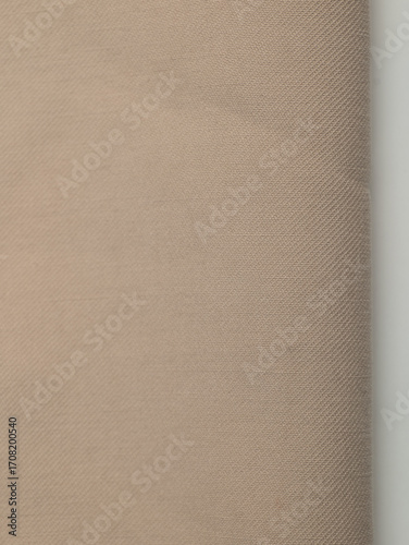 Light, dense fabric for sewing clothes, ironed, the texture of the fabric is visible