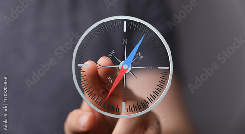 Canvas Print Person using a digital compass, guiding business strategy, planning, and navigation