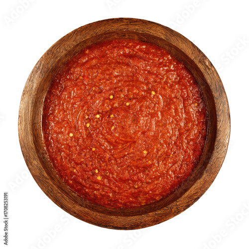 Wooden bowl filled with vibrant red sauce