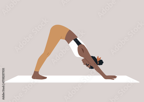 A person holds the inverted V yoga pose, balancing strength and flexibility on a yoga mat, The calm environment enhances focus and promotes a sense of peace during practice.
