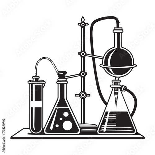 Vintage laboratory setup with flasks, test tube, and distillation apparatus, isolated on white background