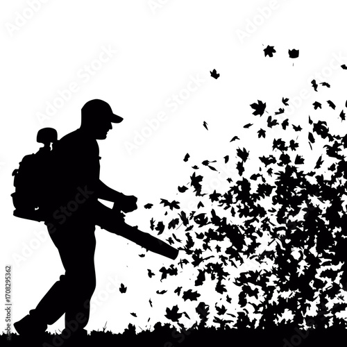 Silhouette of a person a leaf blower to clear leaves, autumn cleanup yard maintenance in a dynamic composition