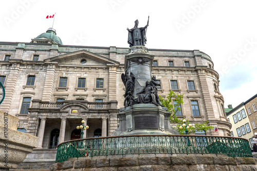 Francois de Laval Monument, the first Roman Catholic bishop of Quebec in front of the Old Post Office of Quebec City, Canada.