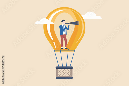 Businessman with telescope in a light bulb shaped hot air balloon looking towards the future