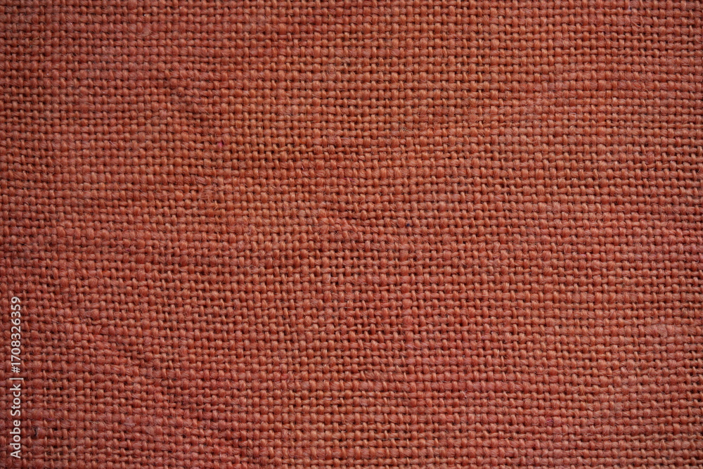 Fototapeta premium orange burlap fabric texture – close-up background top view