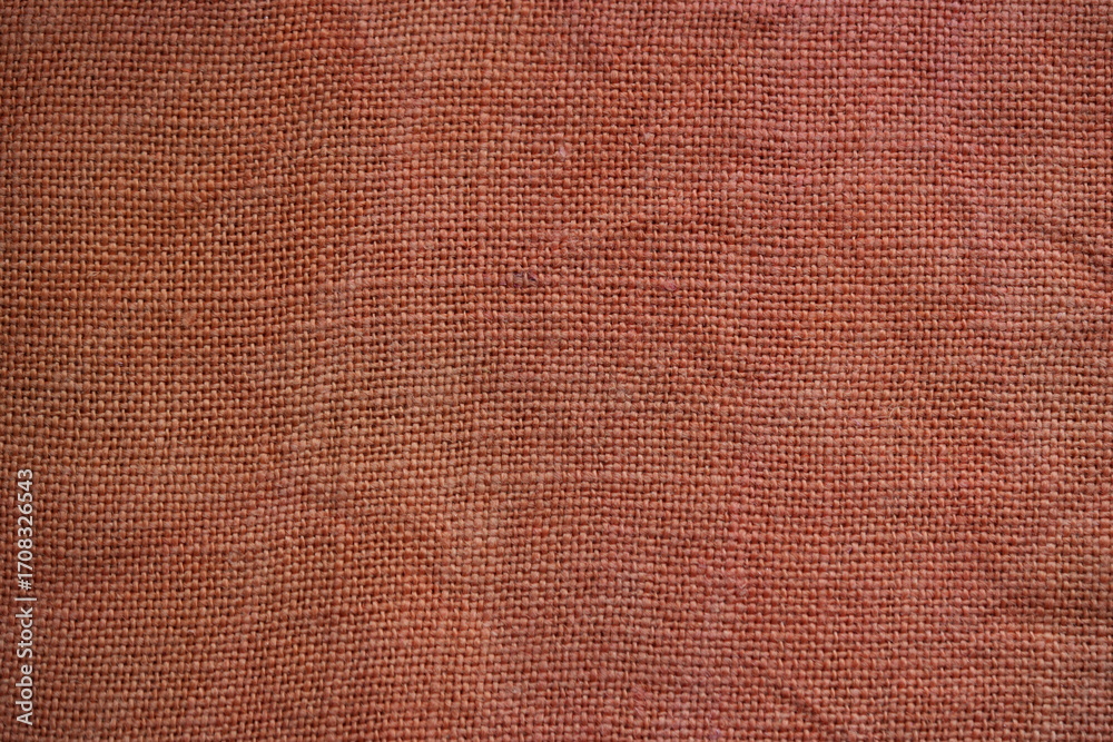 Fototapeta premium orange burlap fabric texture – close-up background top view
