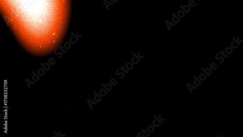 Film light leaks grain add vibrancy to black void space, creating an abstract orange and white frame suitable for dynamic design projects.
