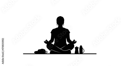 Serene woman meditating in lotus pose with mindful accessories for peaceful living and wellness
