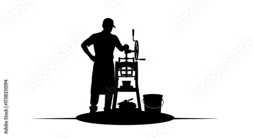 Skilled artisan operating vintage butter churn machine for artisanal dairy production