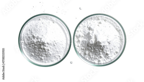 Two clear glass dishes holding white powder