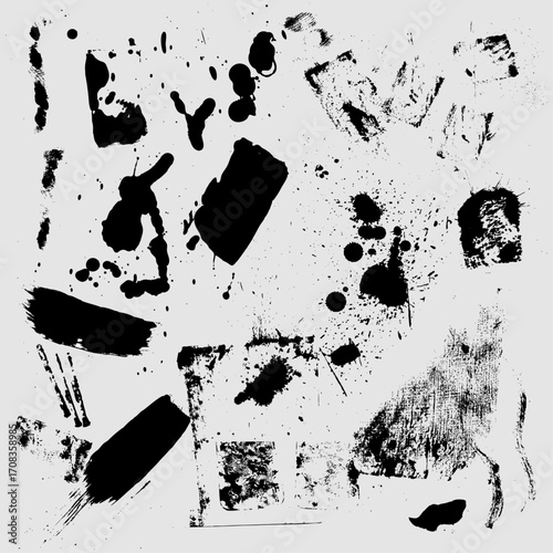 Abstract black ink splatters and brush strokes on white background.