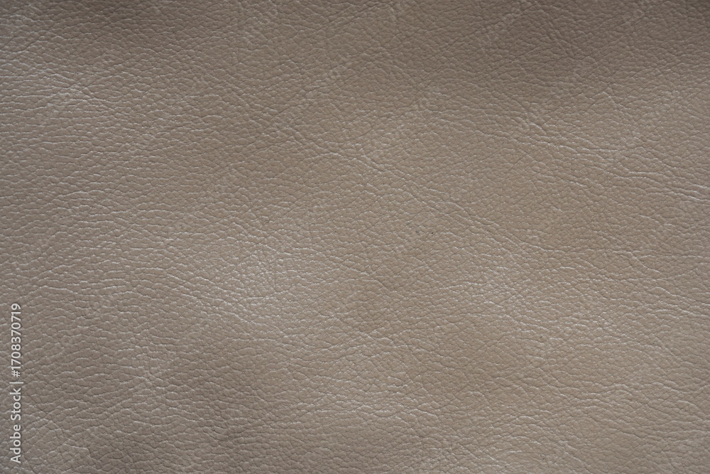 Fototapeta premium beige leather texture close-up, seams on leather jacket as background, beige natural leather as background, light brown leather stitching 