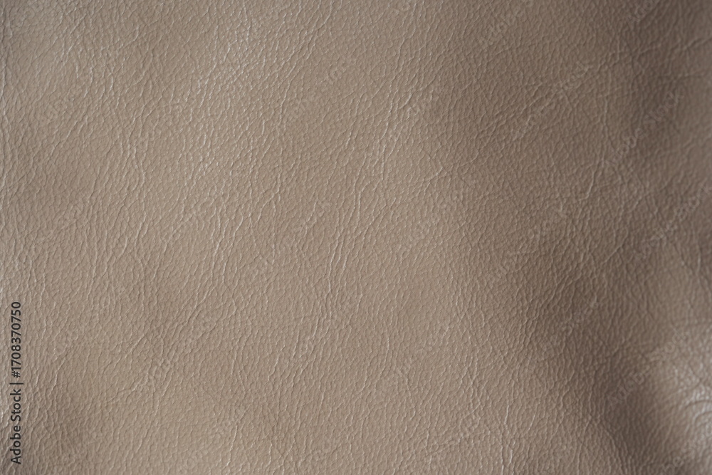 Fototapeta premium beige leather texture close-up, seams on leather jacket as background, beige natural leather as background, light brown leather stitching 