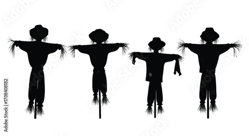 Four silhouette scarecrows standing guard in autumn field ready for harvest season vector