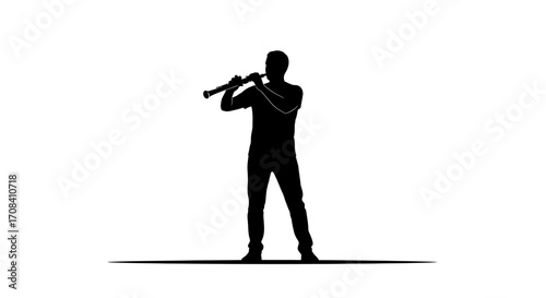 Passionate musician silhouetted while playing a clarinet, creating captivating melodies and artistic expression.