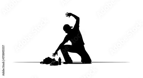 Dynamic dancer silhouette in motion reaching for bag and bottle on floor