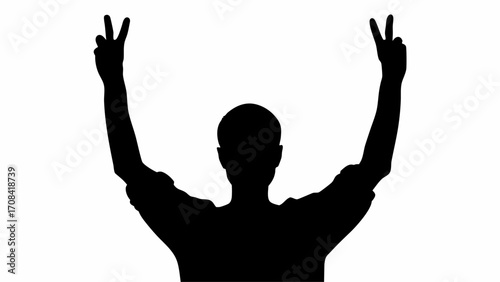 Silhouette of a person raising both arms with hands showing the peace sign in a black and white image