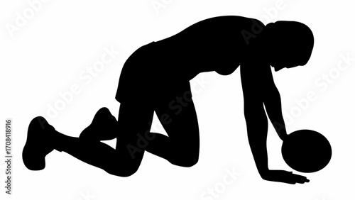 Silhouette of a woman kneeling with one hand on a ball in black and white athletic pose fitness scene