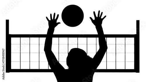 Silhouette of volleyball player spiking the ball over the net in a high stakes competitive match
