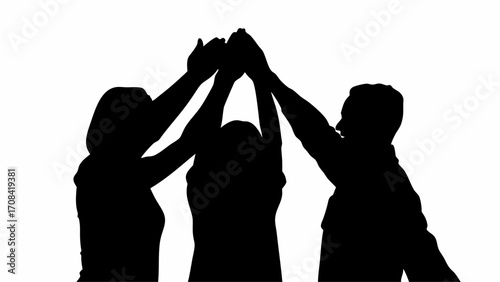 Silhouette of three people with raised hands in a high five gesture symbolizing teamwork and collaboration