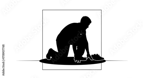 Determined athlete prepares for race tying shoelaces with focus and intensity