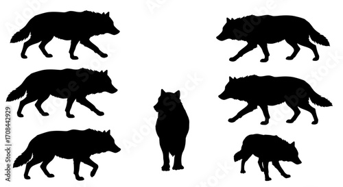 Set of Seven Black Wolf Silhouettes in Various Poses.