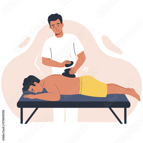 Male massage therapist performing treatment with hot stones  
