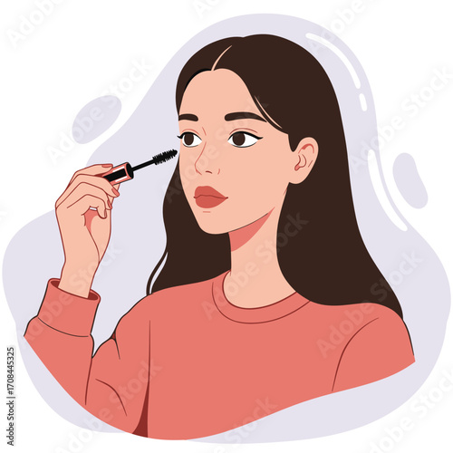 Young woman applying mascara while looking in mirror  