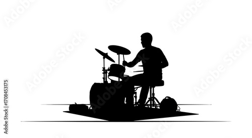 Dynamic drummer silhouette performs energetic rhythm, capturing the pulse of live music performance.