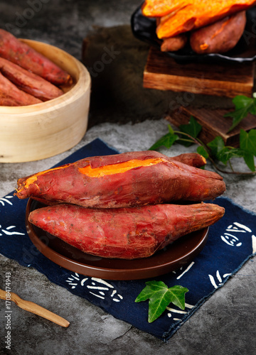 Fresh Roasted Sweet Potatoes with Orange Flesh on Rustic Wooden Table