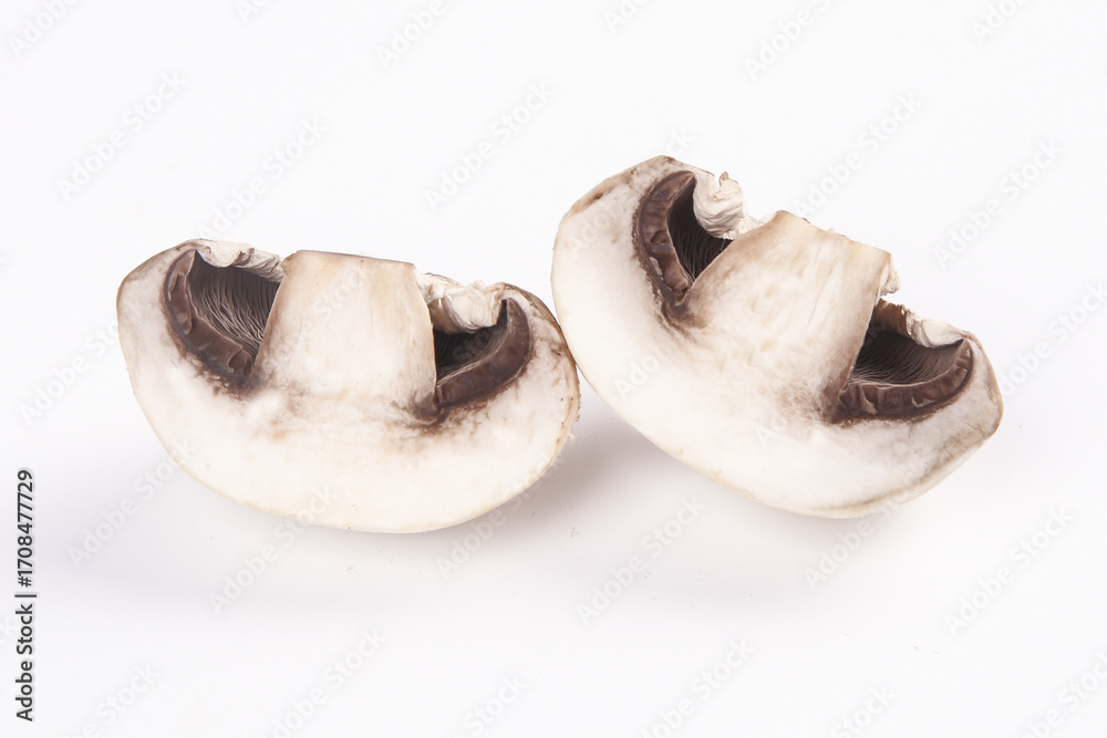 Fototapeta premium Fresh Sliced Mushrooms on White Background Studio Photography