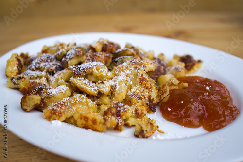 ready to eat - homemade sugared pancake with raisins and apricot jam