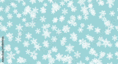 Gentle falling snowflakes create a beautiful winter wonderland scene on a light blue background.