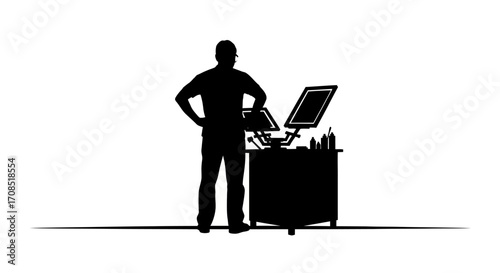 Skilled artisan supervises screen printing station for textile production and garment customization projects