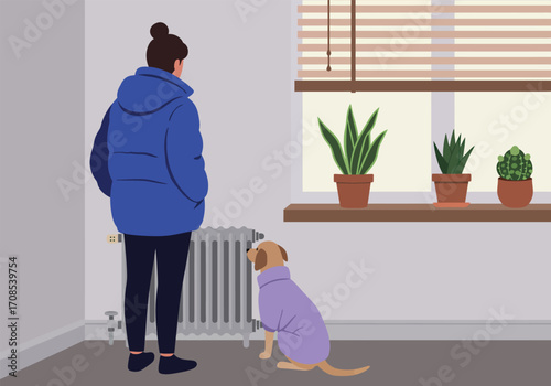 A woman in a blue puffer jacket stands next to a dog wearing a purple sweater in a room with a radiator and a window with plants, creating a cozy and warm indoor scene, showcasing winter attire