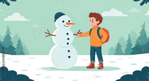 A young boy happily building a snowman in the snow.