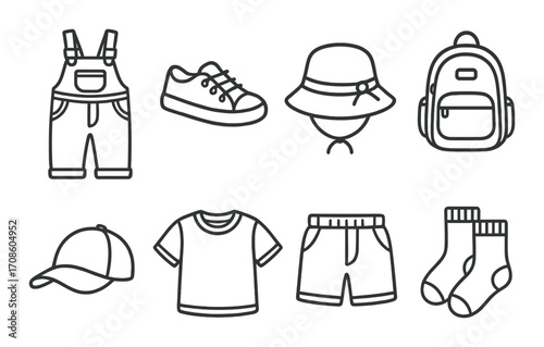 Outline of children's clothing and accessories on dark background