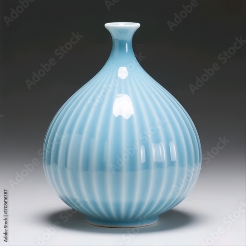 Title:
Light blue ceramic vase with pumpkin-like round shape and vertical grooves