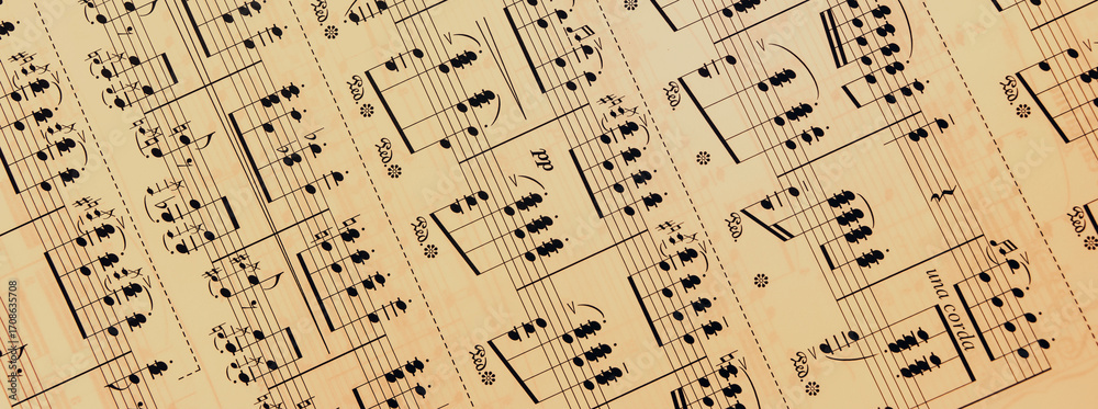Obraz premium Vintage sheet music notation manuscript with staff lines and gently moving musical notes. This retro, grunge styled motion background is a seamless loop.