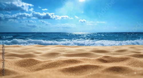 Soft Golden Sand on a Beach With Waves and Blue Sky During a Sunny Day.