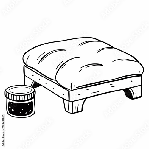 A line art drawing of a cushioned ottoman with a wooden frame and a jar filled with dark substance
