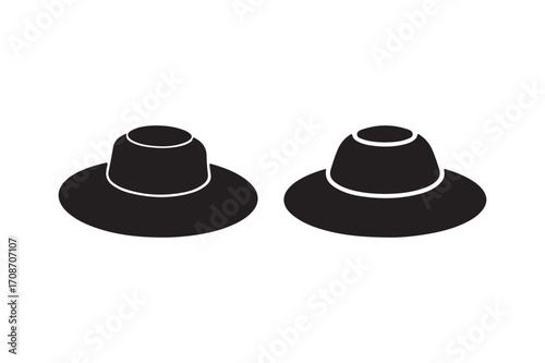 Two black conical objects with wide circular bases and cylindrical tops