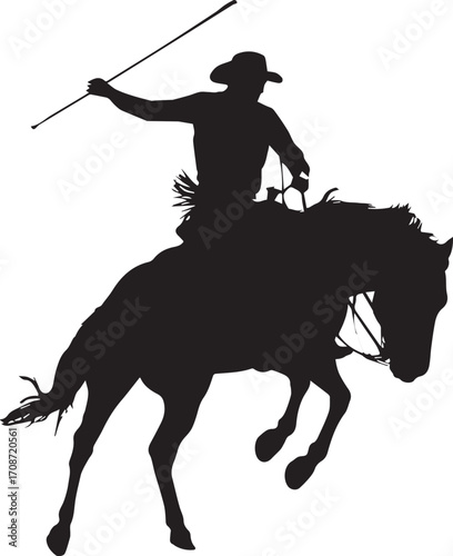 Silhouette of a Cowboy Riding a Bucking Horse with a Whip